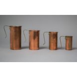 A Set of Four Copper and Brass Handled Cup Measures of Cylindrical Form, Largest 11.5cm high