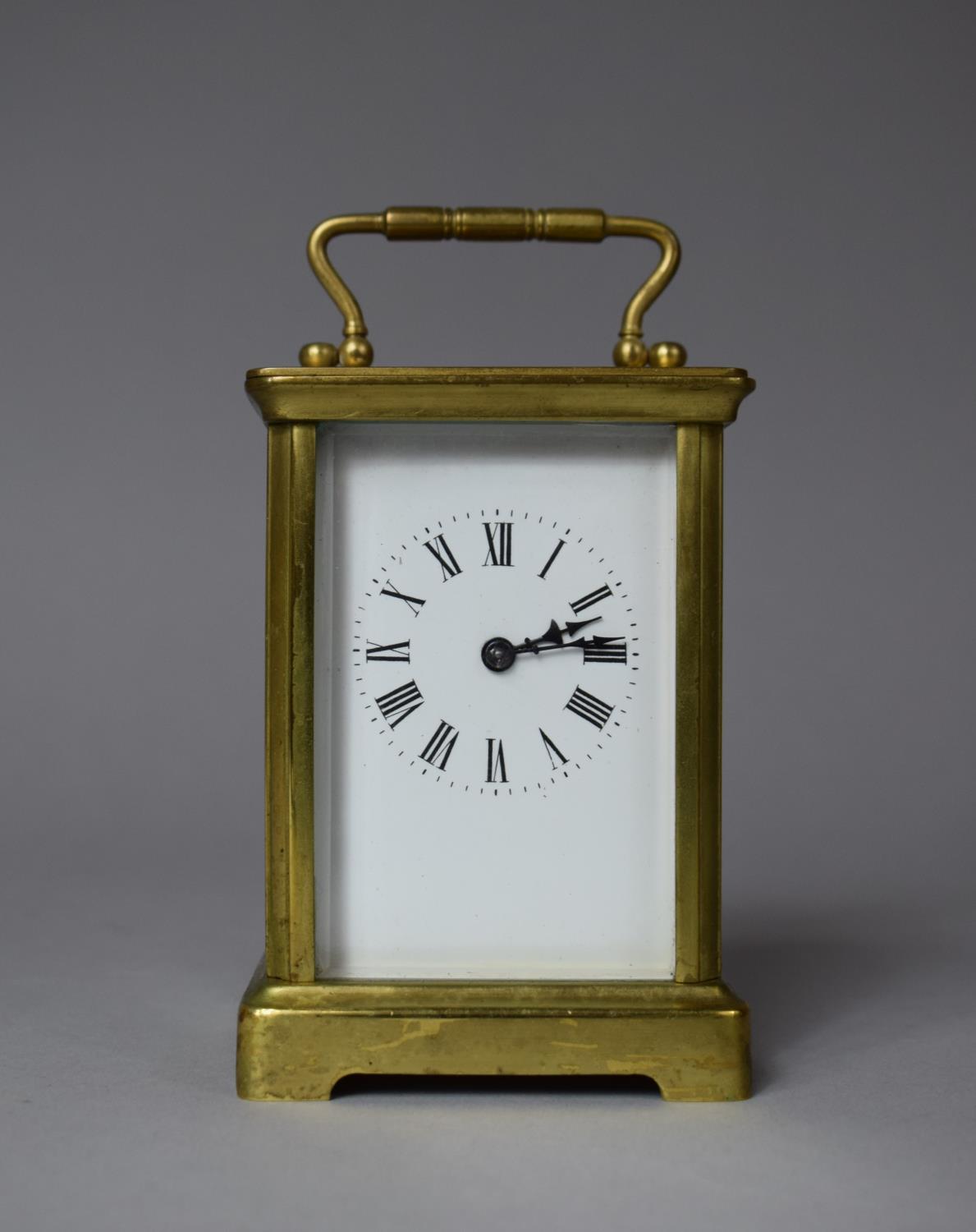 A Brass Carriage Clock with Enamelled Face and Roman Numerals, 11cm high (without handle), Running