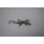 A Silver and Marcasite Lizard Brooch, Marked Silver, England, 6.5cm wide