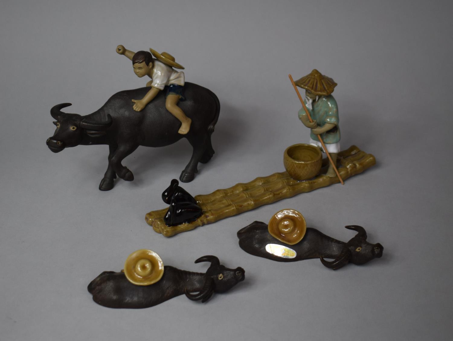 A Collection of Various Mud Men Figures to Include Mounted Boy on Water Buffalo, Fisherman on Bamboo