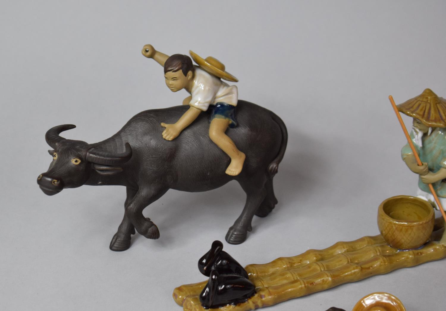 A Collection of Various Mud Men Figures to Include Mounted Boy on Water Buffalo, Fisherman on Bamboo - Image 2 of 4