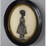 A 19th Century Oval Framed Silhouette of Standing Young Girl with Whip in Hand, with Easel Back
