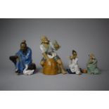A Collection of Four Glazed Chinese Mud Men