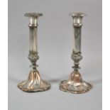 A Pair of Sheffield Plated Candle Sticks, 23cm high