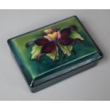 A Moorcroft Rectangular Lidded Box with Hibiscus Flower Decoration, 12cms Long