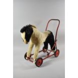 A Vintage Childrens Ride on/Push Along Walker in the Form of a Horse, 49cms High