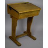 A Vintage Wooden School Desk with Hinged Sloped Writing Slope Revealing Inner Store, Iron Hinges