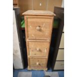 A Narrow Pine Chest of Three Drawers, 45cms Wide by 124cms High