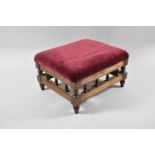 A Small Stool with Spindle Supports and Upholstered Top, 32cms Wide x 17cms High