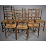 A Collection of Seven Various Rush Seated Chairs