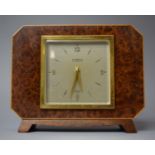 An Art Deco Burr Walnut Mantel Clock by Elliot Clock and Retailed by T A Henn and Sons, 19cms
