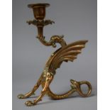A Brass Gothic Revival Candle Holder in the Form of a Griffin, 18cms High