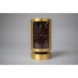 A Mid 20th Century Swiza 8 Brass Desktop Alarm Clock Of Cylindrical Canister Form with Inner Red