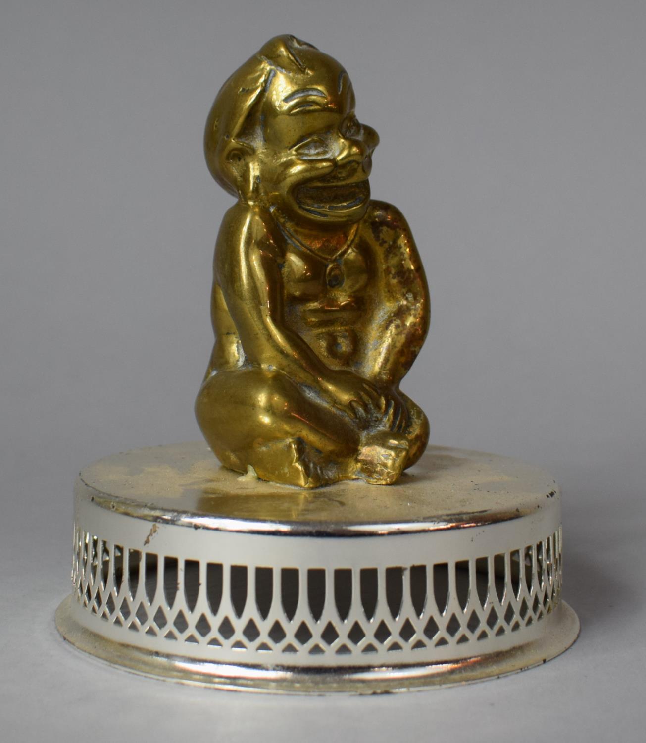 A Vintage Cast Brass Car Mascot in the Form of a Seated Baby on Later Mounted Silver Plated