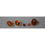 A Collection of Amber Jewellery including Two pairs of Earrings and a White Metal Mounted Ring