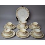 An Edwardian Crown Part Tea Set Comprising Teacups, Saucers, Side Plates, Cake Plates, Slop Bowl and