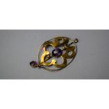 An Edwardian 9ct Gold and Purple Stone Pendant, 1.2gms