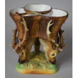 A Continental Bisque Porcelain Three Section Table Centre, with Tri Stag Head Supports on
