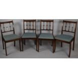 A Set of Four Dining Chairs with Spindles Rosset Stylised Backs and Upholstered Pad Seats