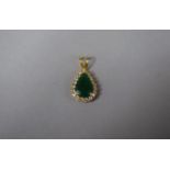 A Gold, Diamond and Emerald Pendant of Tear Shape. 2.1gms