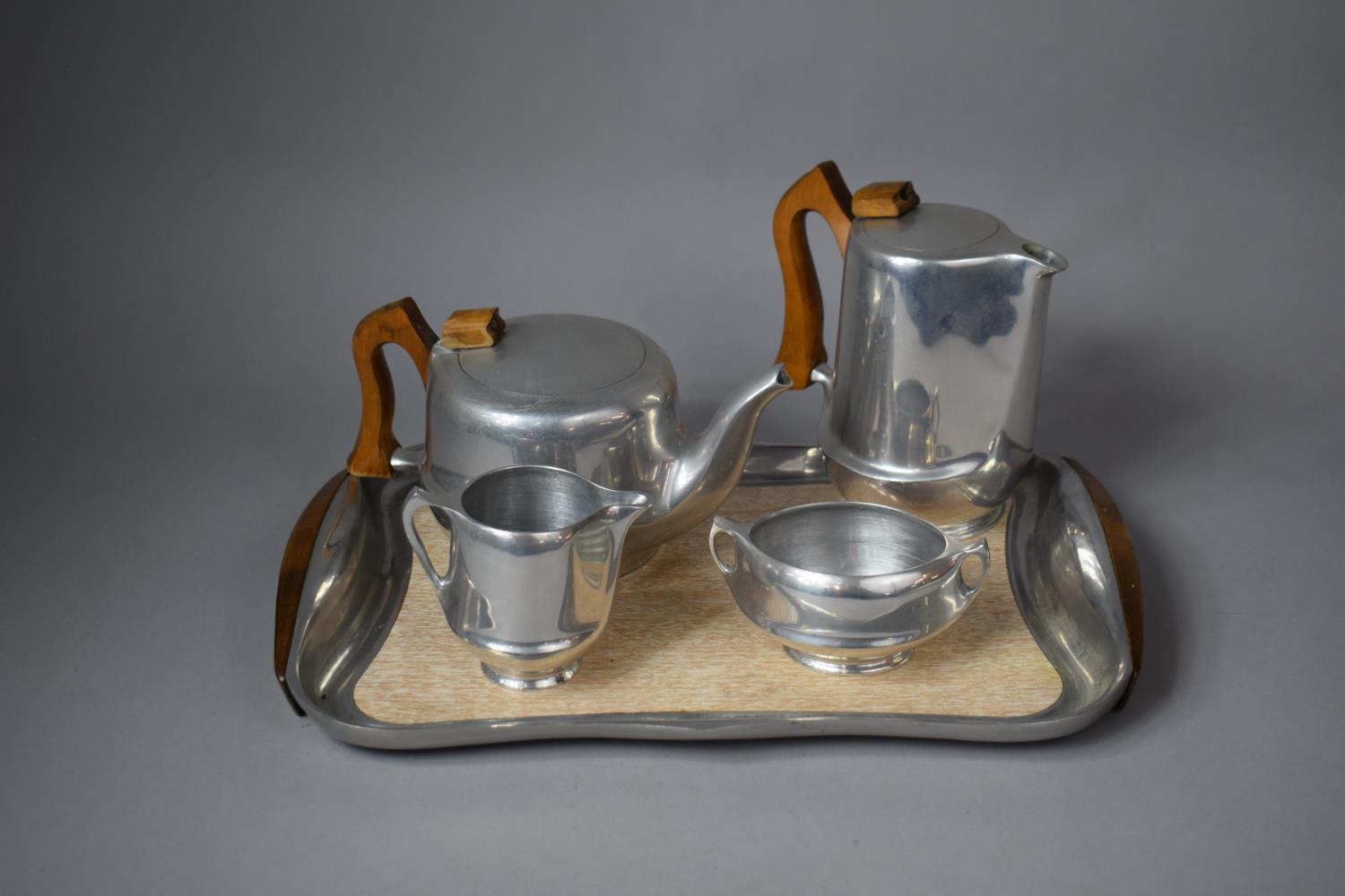 A Four Piece Picquot Ware Tea Set Comprising Teapot, Milk, Sugar, Coffee and Tray