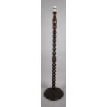 A Turned Wooden Bobbin Standard Lamp Supported on Circular Stepped Base, 142 cms High