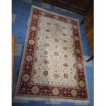 A Woollen Keshan Style Rug on Red and Cream Ground, 244x150cm