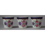 Three 19th Century Porcelain, Possibly Sampson, Cache Pots of Barrel Form Housing Floral Spray