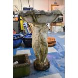 A Reconstituted Stone Birdbath having Three Graces support and Shell Shaped Dish, Dish 55cms Wide,