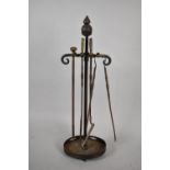A Wrought Iron Fire Companion with Pineapple Style Finials together with Four Fire Irons, 90cms High