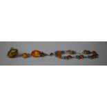 Four Pieces of Silver and White Metal Mounted Amber Jewellery having Botanic Inspired Mounts