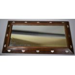 An Arts and Crafts "Liberty of London" Rectangular Wall Mirror, The Mahogany Frame Inlaid with