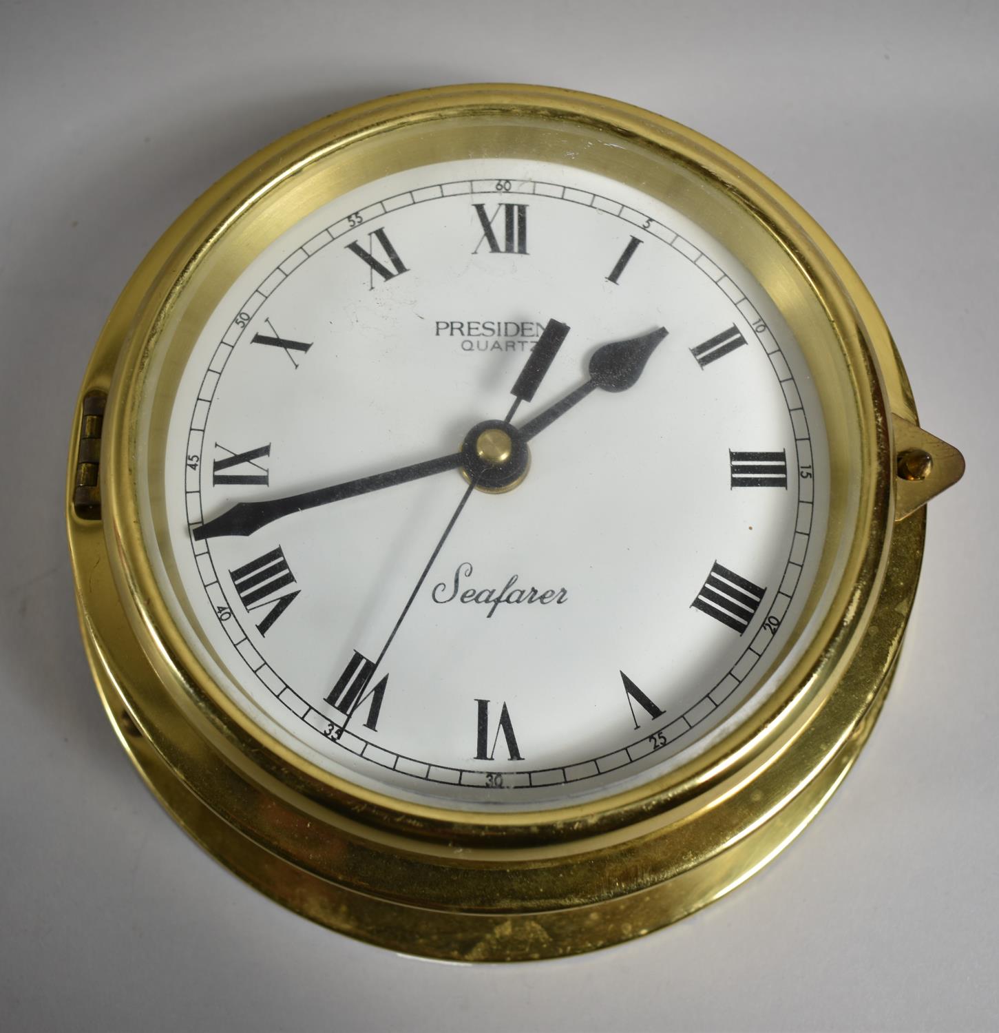 A Reproduction Brass Bulkhead Mounting Ships Clock , President Seafarer, Battery Movement, 18cm