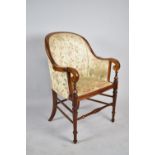 An Edwardian Mahogany Framed Ladies Tub Armchair with Turned Supports and Scrolled Arms, For