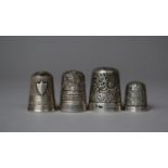 A Collection of Four Silver Thimbles