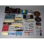 A Collection of Sundries to Include Cloth and Metal Tape Measures, Wrist Watch, Vintage Car Model (