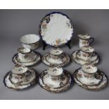 An Edwardian "Rococo and Poppy" Tea Set Comprising Six Trios, Cake Plate, Cream Jug and Sugar, Sugar