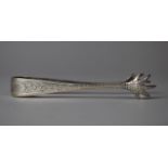 A Silver Sugar Bow with Engraved Decoration and Bird Claw Ends, Sheffield 1904