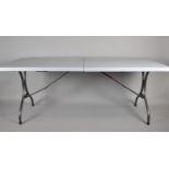 A Large Modern Plastic and Iron Folding Trestle Table, 181cm Long