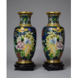 A Pair of Oriental Cloisonne Vases with Floral Decoration on Pierced Circular Wooden Stands, 21cm