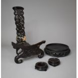 A Collection of Four Various Chinese Carved and Pierced Vase Stands and Charger Rest