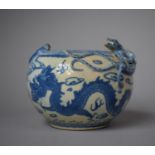 A 19th Century Chinese Blue and White Pot of Squat Form Decorated with Dragons Chasing Flaming Pearl