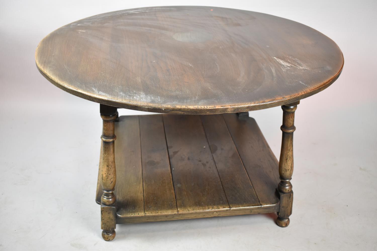 A Mid 20th Century Circular Topped Oak Centre Coffee Table with Square Stretcher Shelf, Water Damage