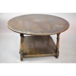 A Mid 20th Century Circular Topped Oak Centre Coffee Table with Square Stretcher Shelf, Water Damage