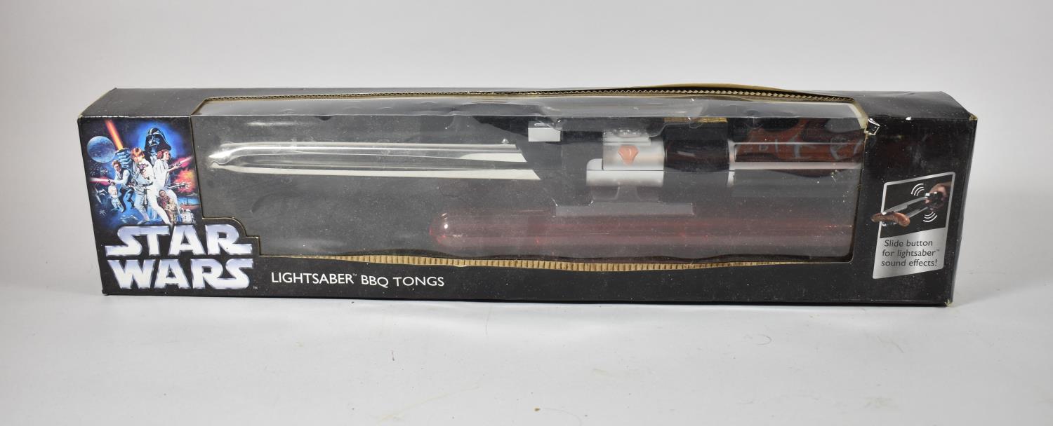 A Cased Set of Star Wars Lightsaber BBQ Tongs in Original Box