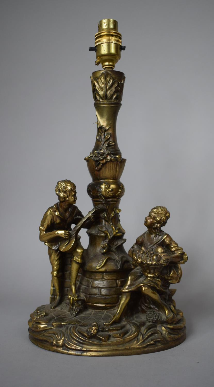 A Gilt Painted Resin Table Lamp Base, Depicting Boy Playing Mandolin and Girl with Basket of