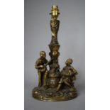A Gilt Painted Resin Table Lamp Base, Depicting Boy Playing Mandolin and Girl with Basket of