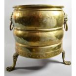 A 20th Century Brass Cylindrical Coal Bucket with Lion Mask Ring Carrying Handles and Three Claw