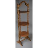 An Edwardian Oak Three Tier Cake Stand with Barley Twist Supports, 90cm high