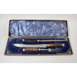 A Cased Silver Banded Three Piece Carving Set with Antler Handles by Walker & Hall, Sheffield 1934